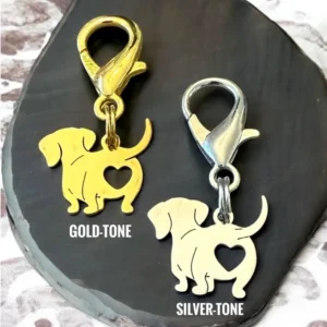 Gold and silver dog charms with hearts.