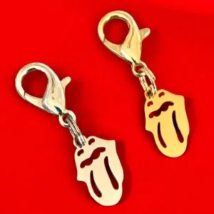Silver and gold tongue-shaped charms on red.