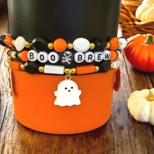 Halloween bracelets with ghost charm on cup.