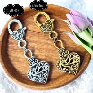 Heart-shaped keychains with tulips on tray.