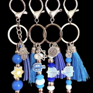 Three keychains with blue beads and decorative charms.