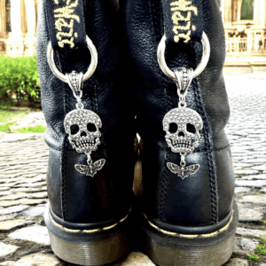 Black boots with silver skull and crossbones chains attached.