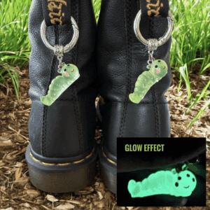 Glow-in-the-dark keychains attached to black boots.