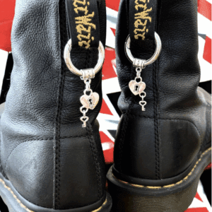 Black boots with unique key-shaped zipper pulls.