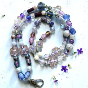 Colorful beaded necklace with purple and blue accents.