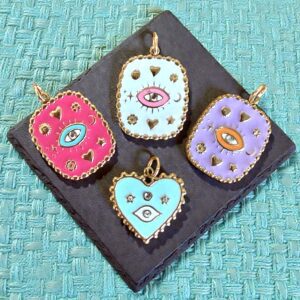 Colorful felt keychains with cute monster and heart designs.